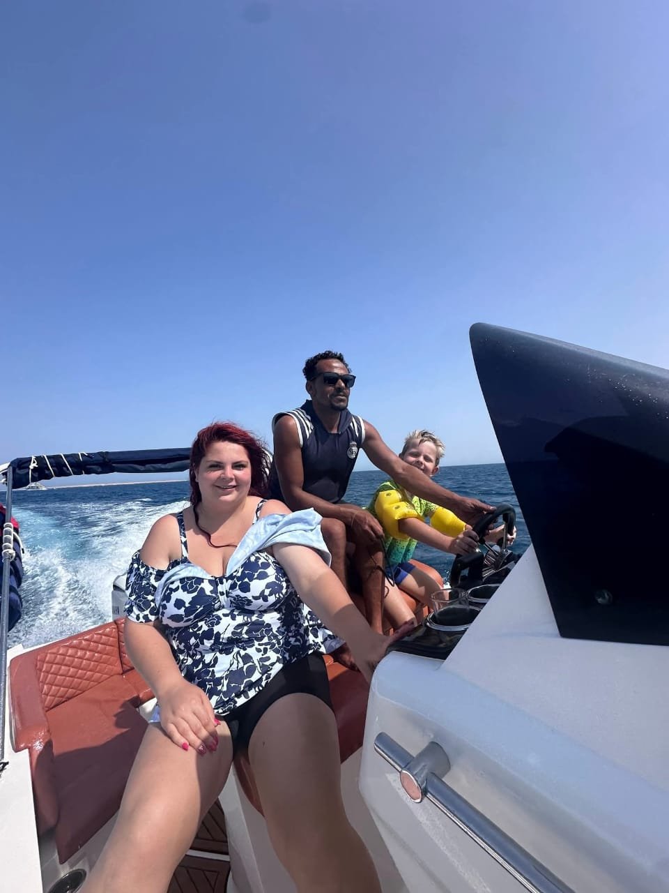 Passengers and captain aboard the private speedboat
