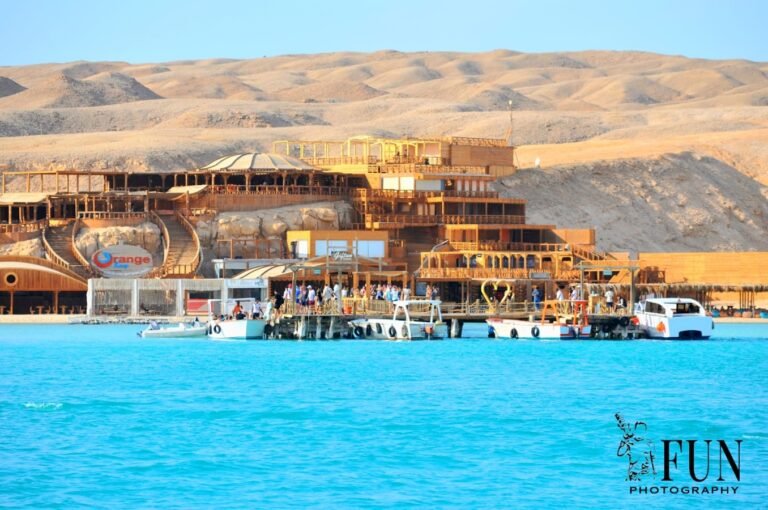 Orange Bay vs Paradise Island comparison – Orange Bay waterfront and boats