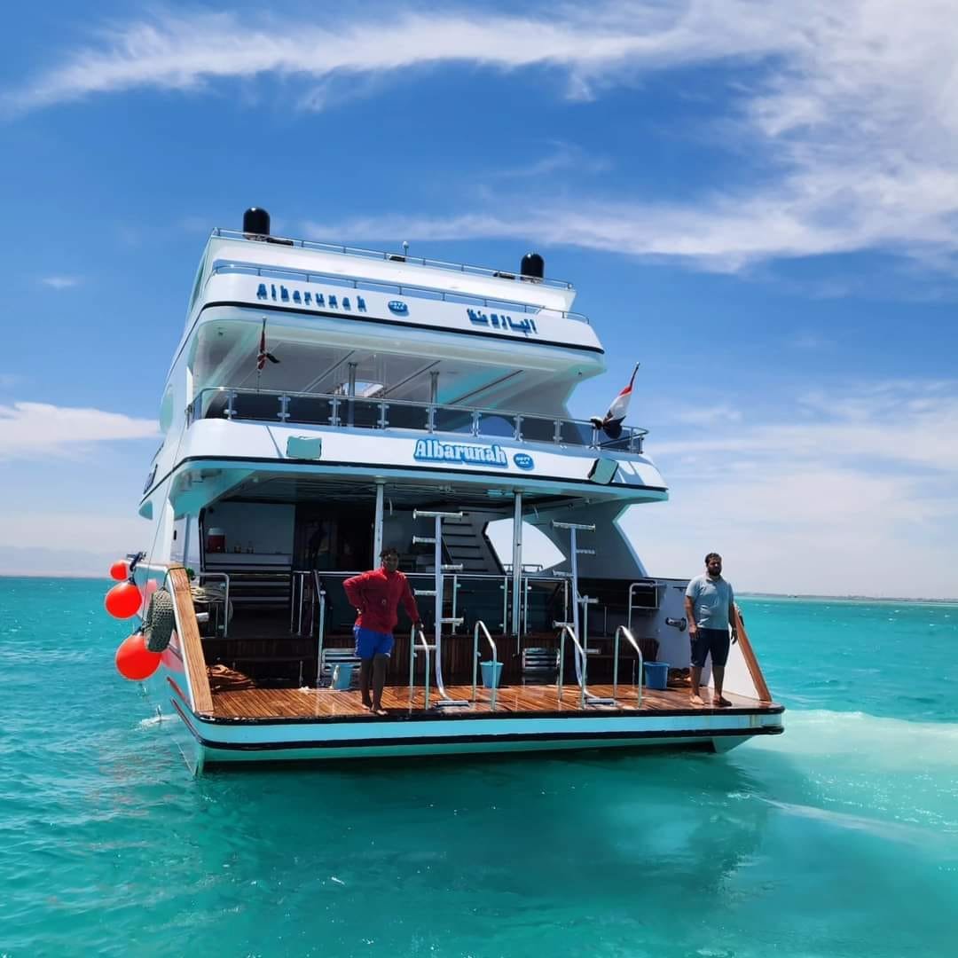 Passengers at the rear swimming platform of an excursion boat
