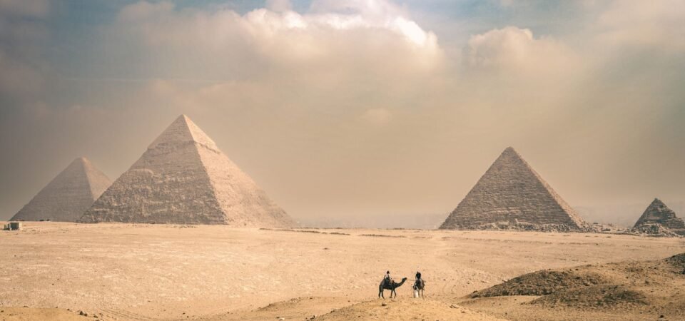 Pyramids of Giza under a dramatic sky in Egypt