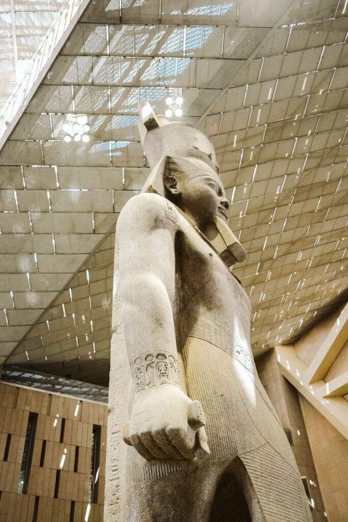 Ancient Egyptian statue displayed in a museum gallery