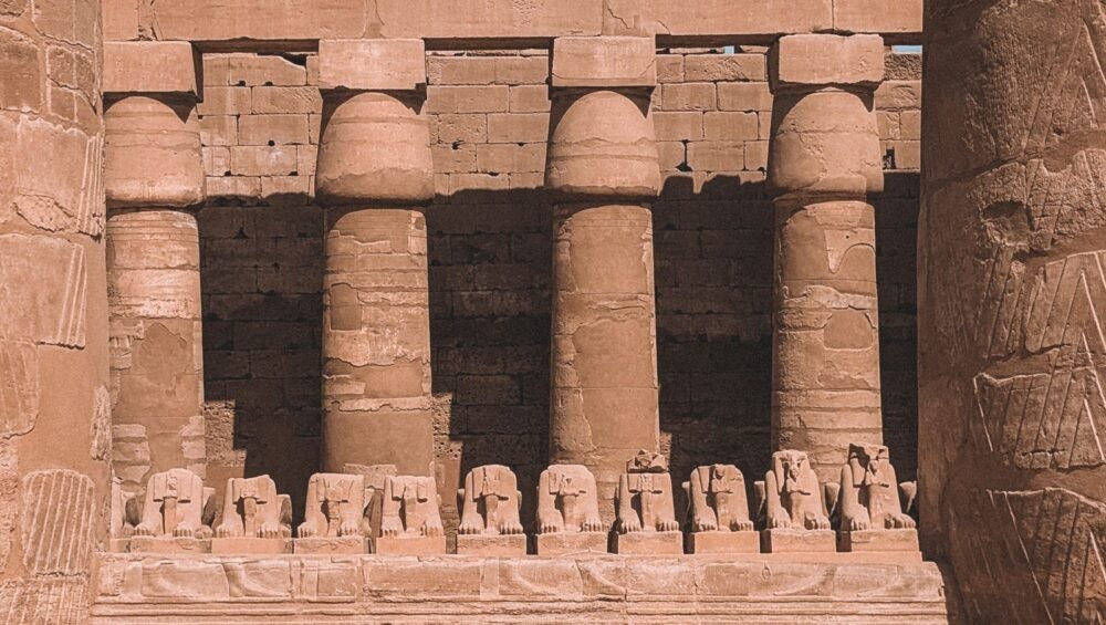 Stone columns and ram-headed sphinxes at Karnak Temple
