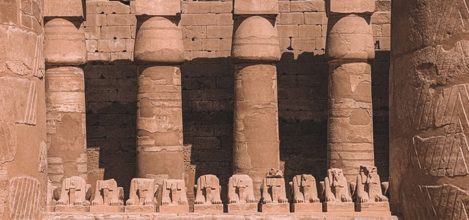 Stone columns and ram-headed sphinxes at Karnak Temple