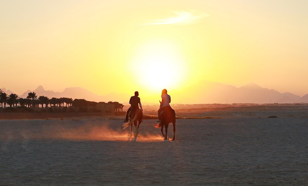 Horse riders at sunset in the desert near Hurghada